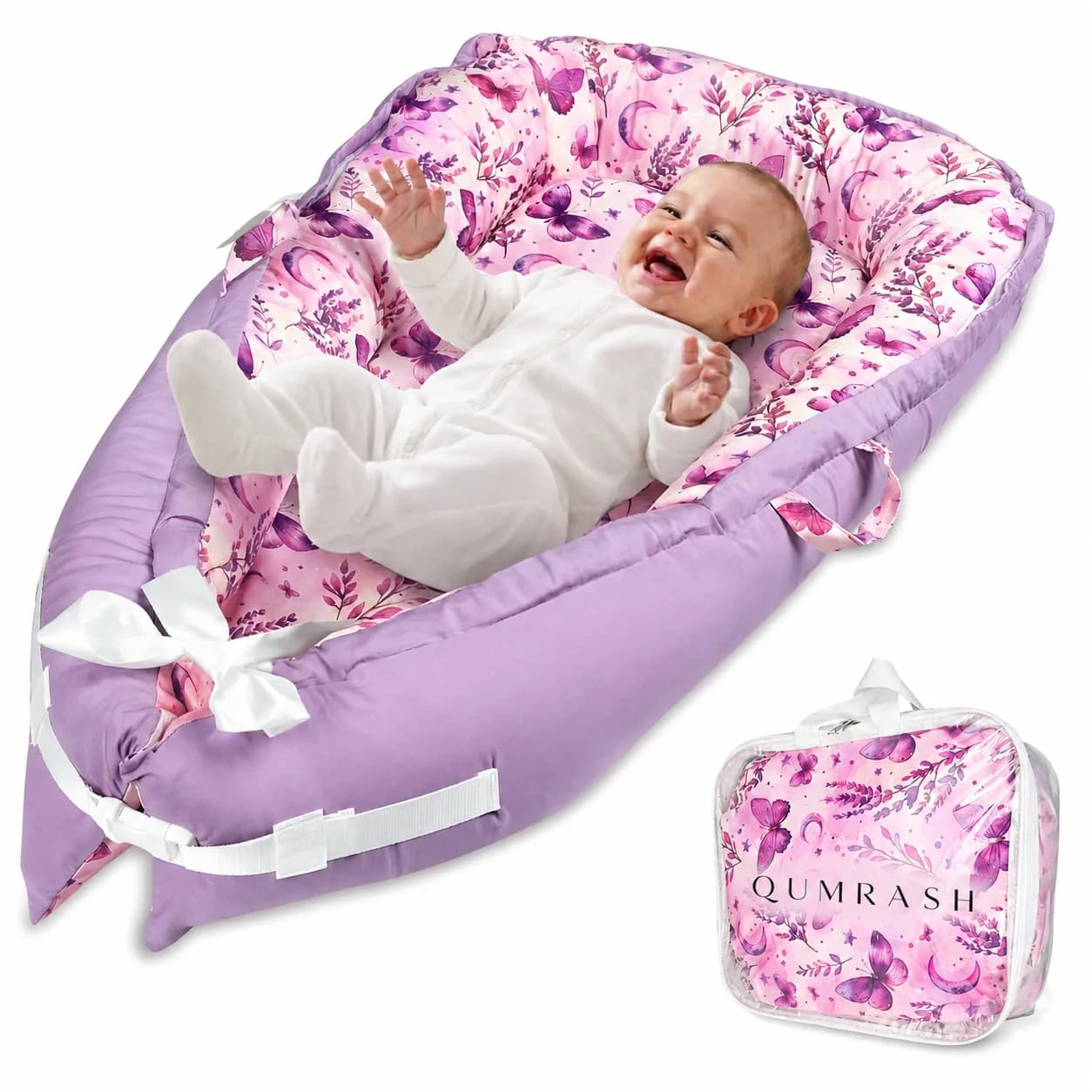 Baby lying in the Qumrash butterfly lavender baby lounger, with its clear carry bag