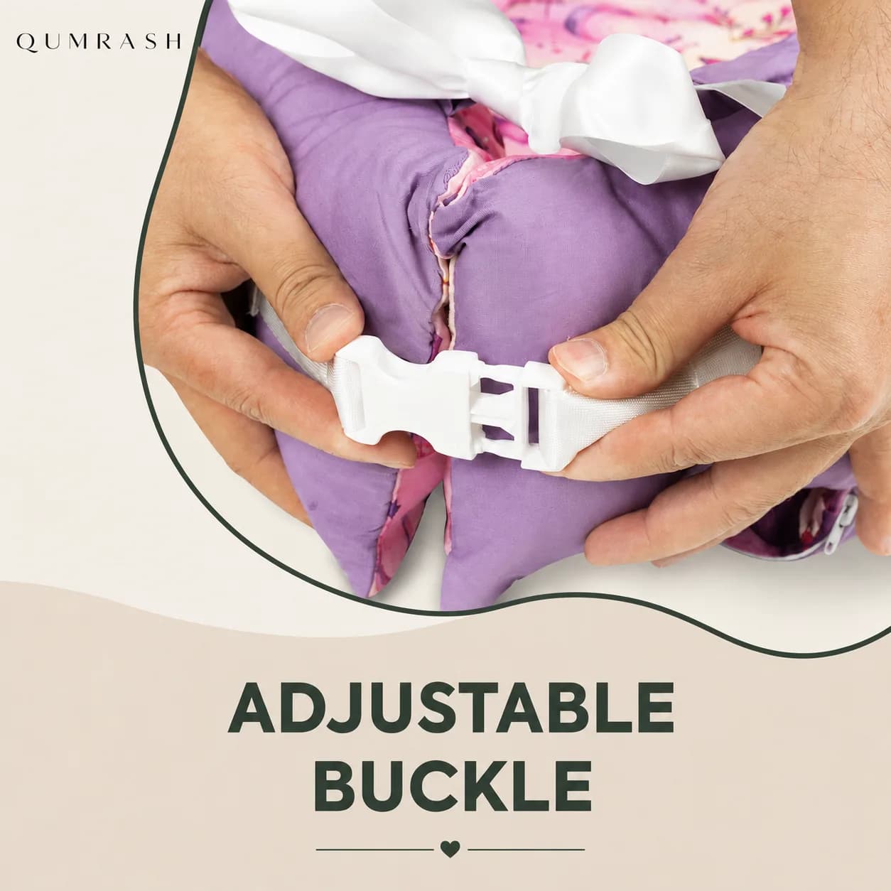 Hands fastening the adjustable buckle that opens the lounger as baby grows